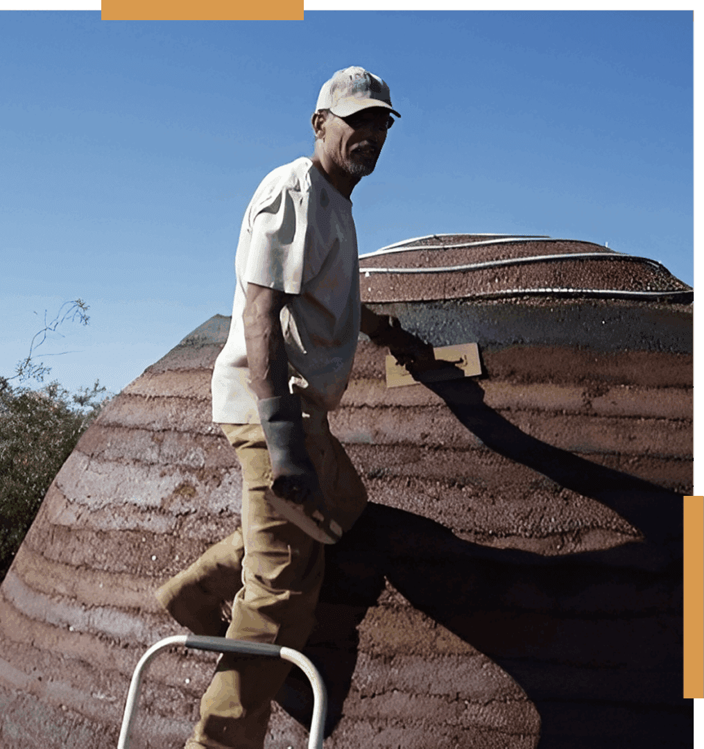 Man working on a large outdoor structure.